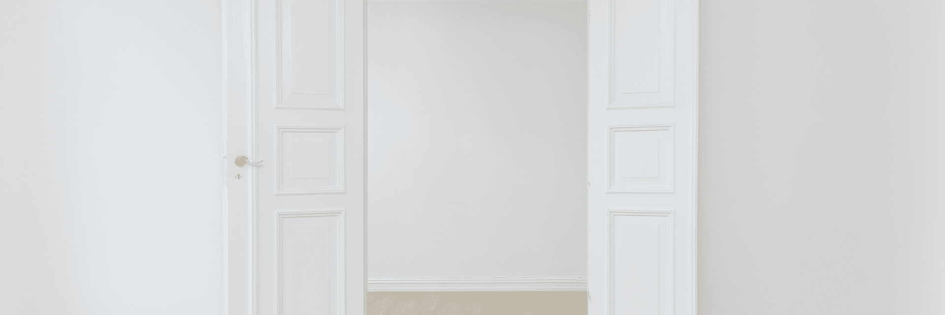 Two white doors wide open representing access to the workplace